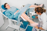 © Woman during examination by a gynecologist. Having advise with her gynecologist. colposcopy - Woman during examination by a gynecologist. Having advise with her gynecologist. colposcopy